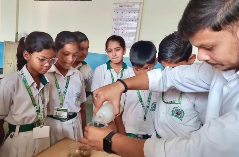 DWPS students conduct a hands-on experiment to measure the water percolation rate in soil